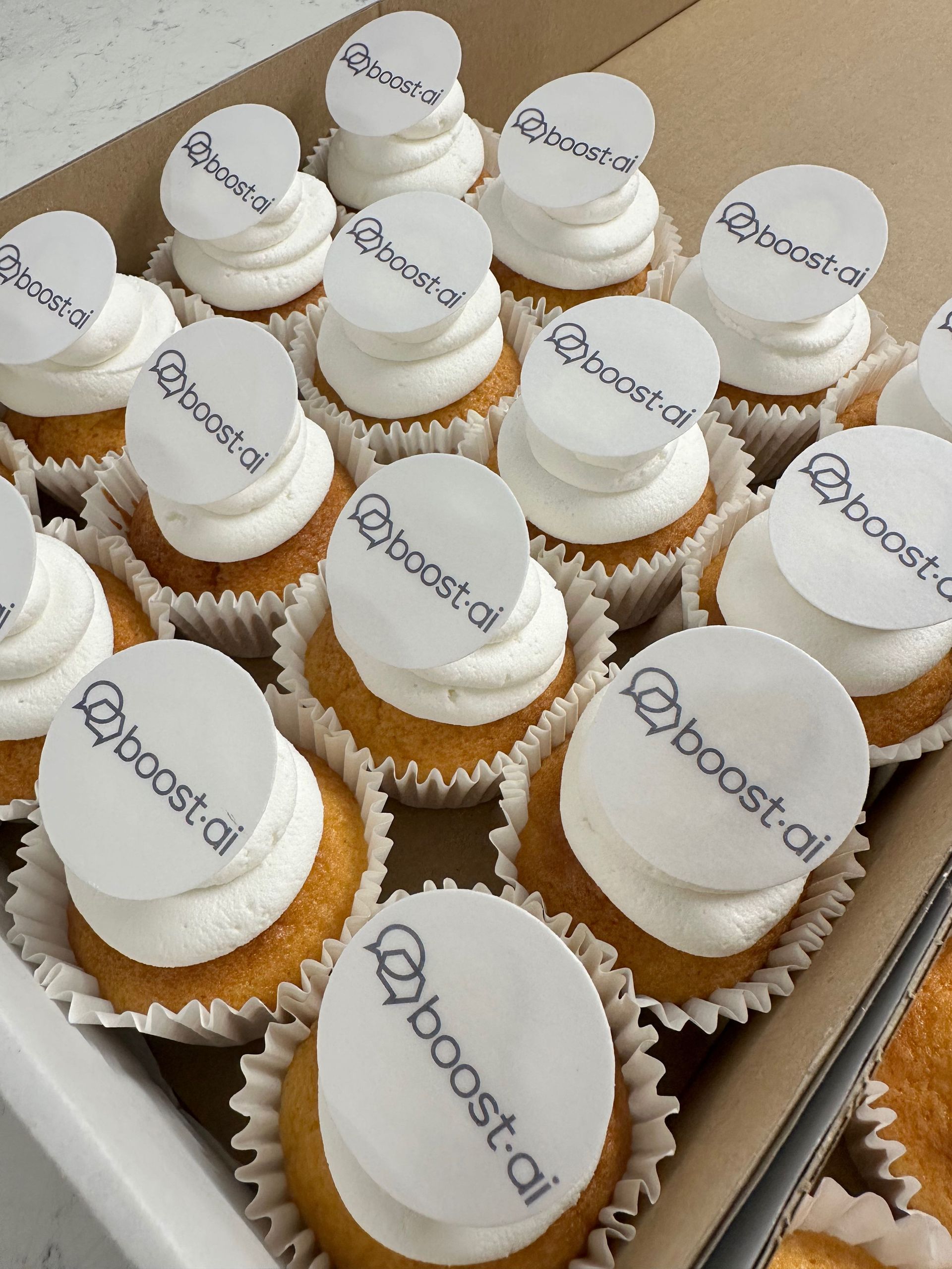 Bespoke branded cupcakes with custom frosting colours