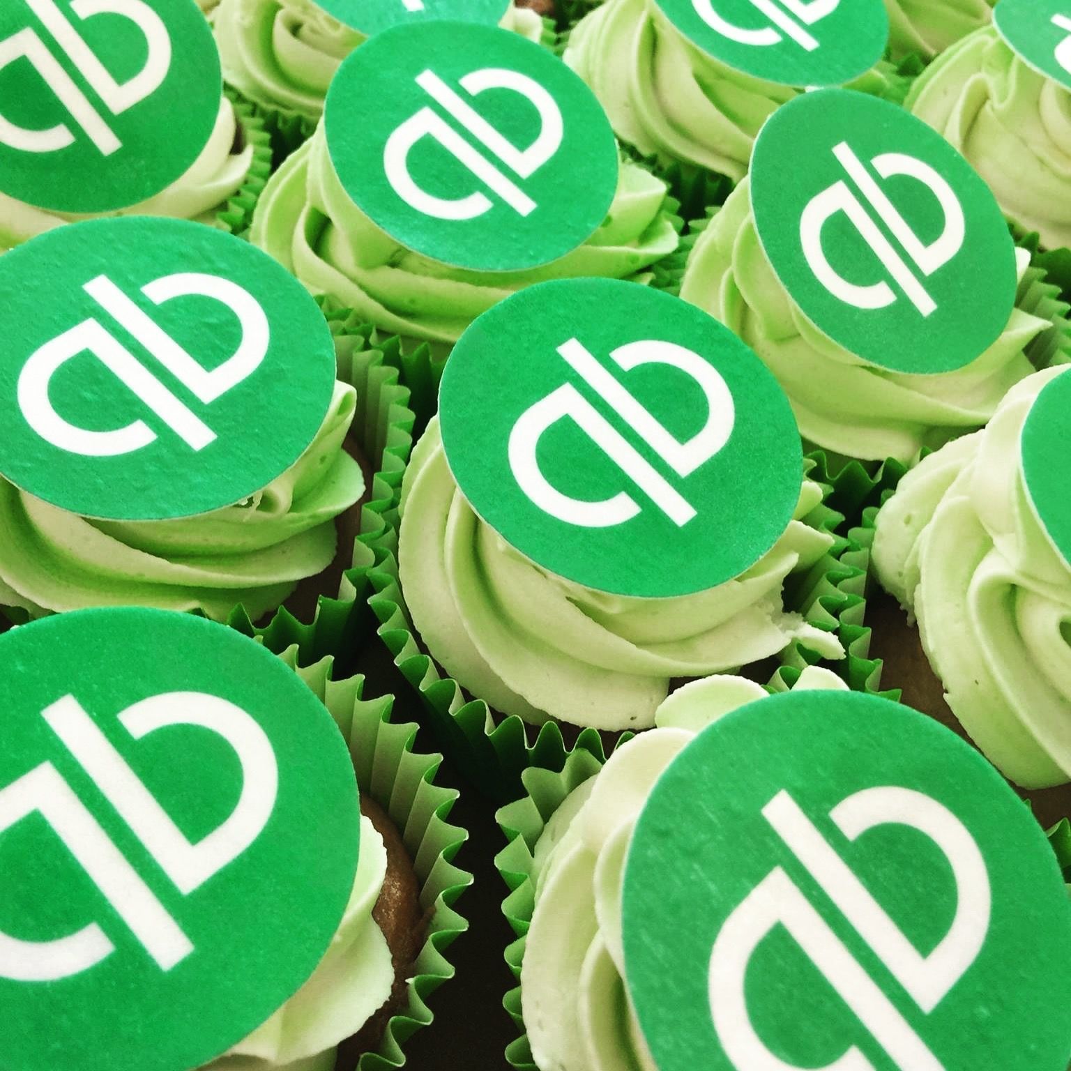 QB branded cupcakes with precision logo toppers