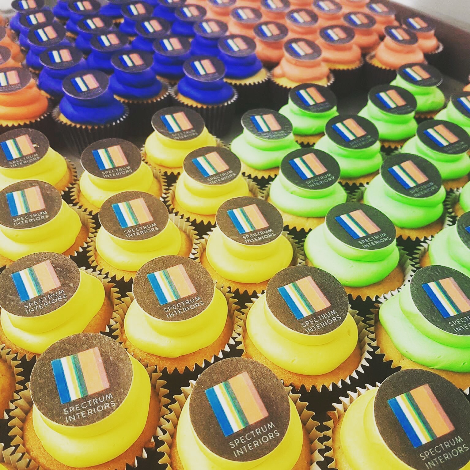 Hand-decorated cupcakes for corporate celebration